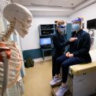 Two Physician Assistant students practice taking vital signs in the Clinical Skills Simulation Center (SimClin) at the Tufts University School of Medicine